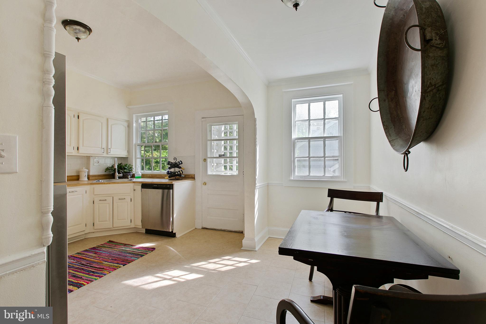 511 Woodside Road Baltimore, MD 21229 - Photo 15 of 57 Eat-in kitchen w/ceramic floors & access to yard