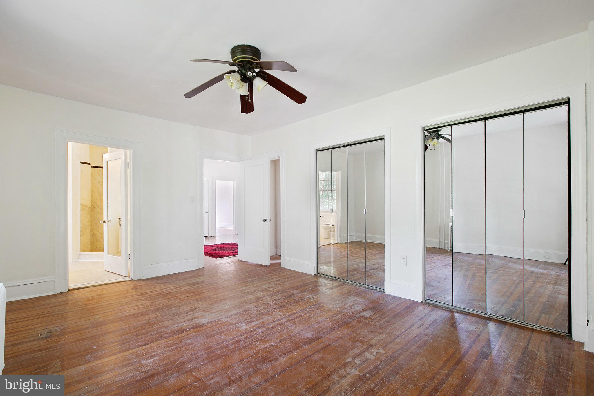 511 Woodside Road Baltimore, MD 21229 - Photo 31 of 57 Master bedroom with mirrored closet doors