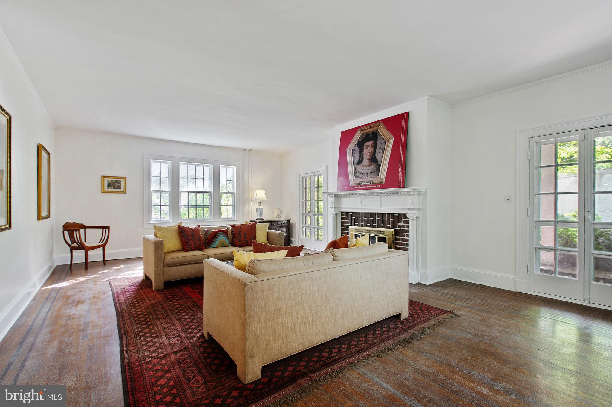511 Woodside Road Baltimore, MD 21229 - Photo 6 of 57 Formal living room has direct access to side porch