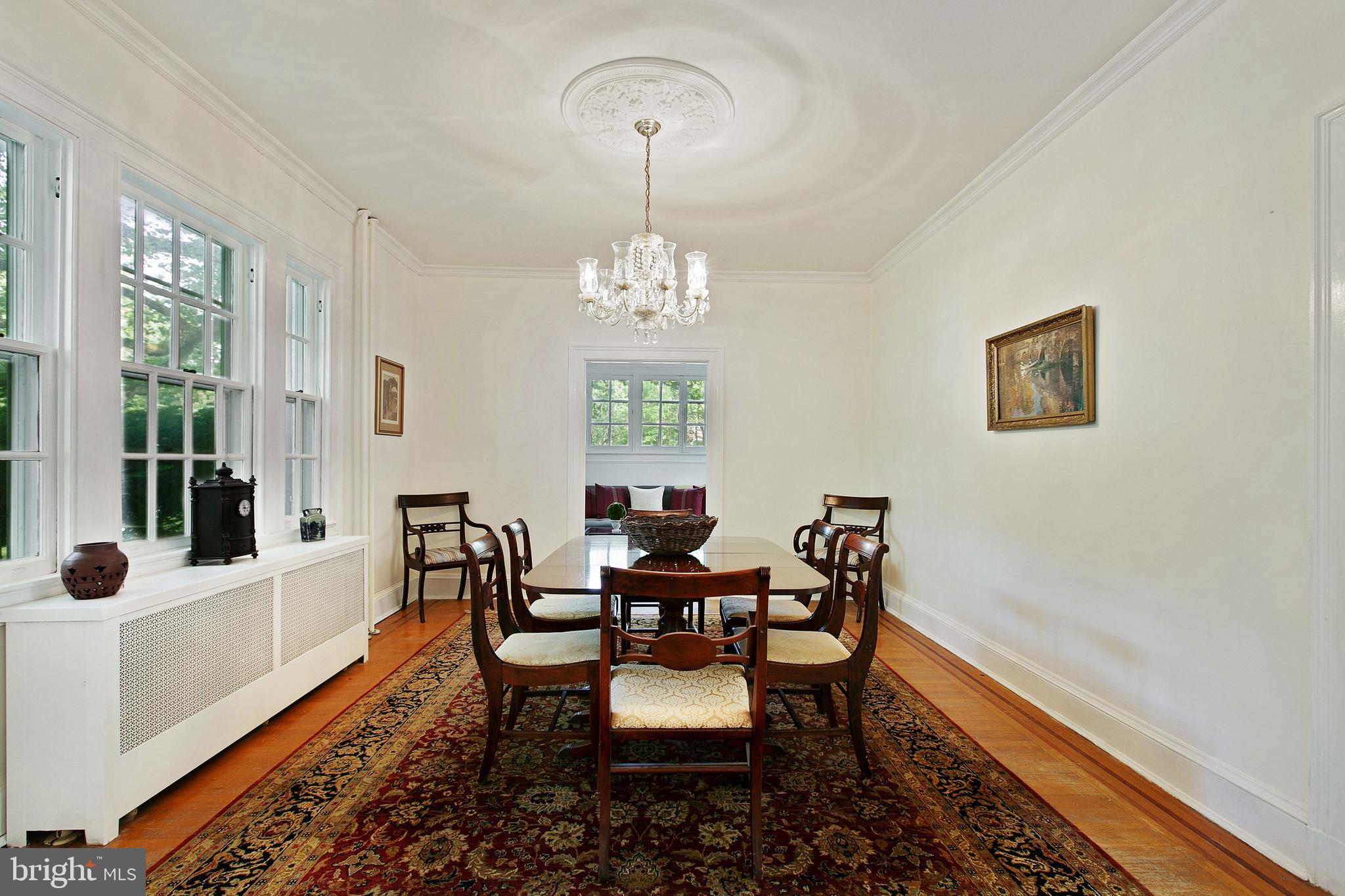 511 Woodside Road Baltimore, MD 21229 - Photo 10 of 57 Formal dining room has access to sun room
