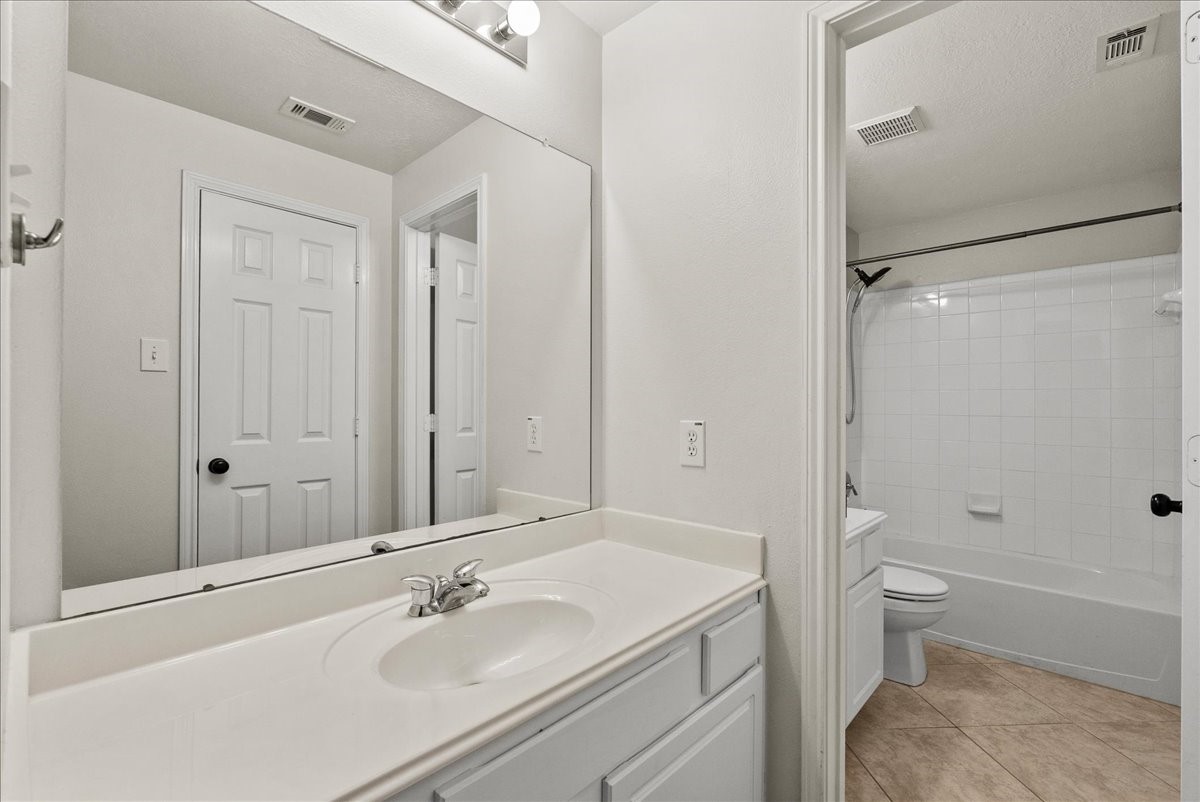 2876 Match Point Lane Friendswood, TX 77546 - Photo 38 of 45 Ample counter space and private tub and commode in this bathroom near game room and bedroom.