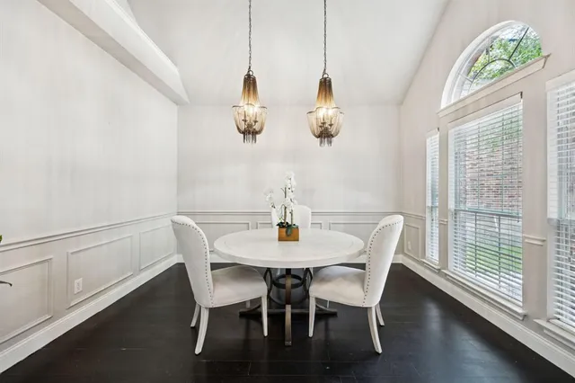 a kitchen with sink refrigerator and cabinets