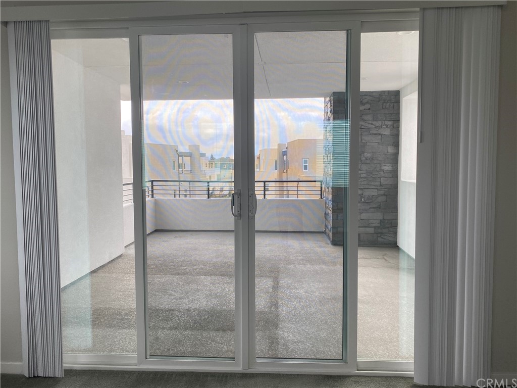 163 Stage Irvine, CA 92618 - Photo 16 of 18 a view of a glass door with a door