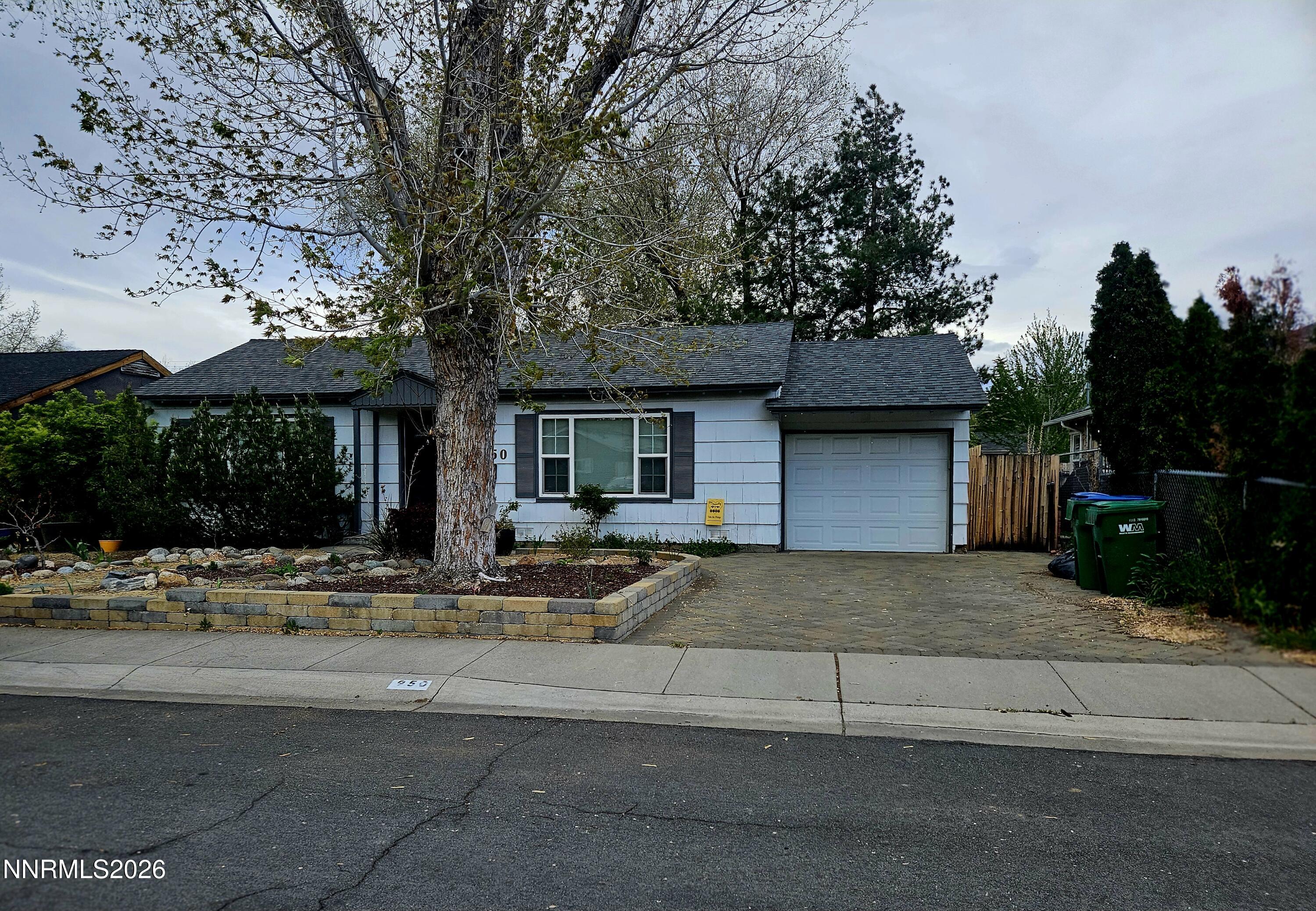 a front view of a house with basket ball court and outdoor seating
