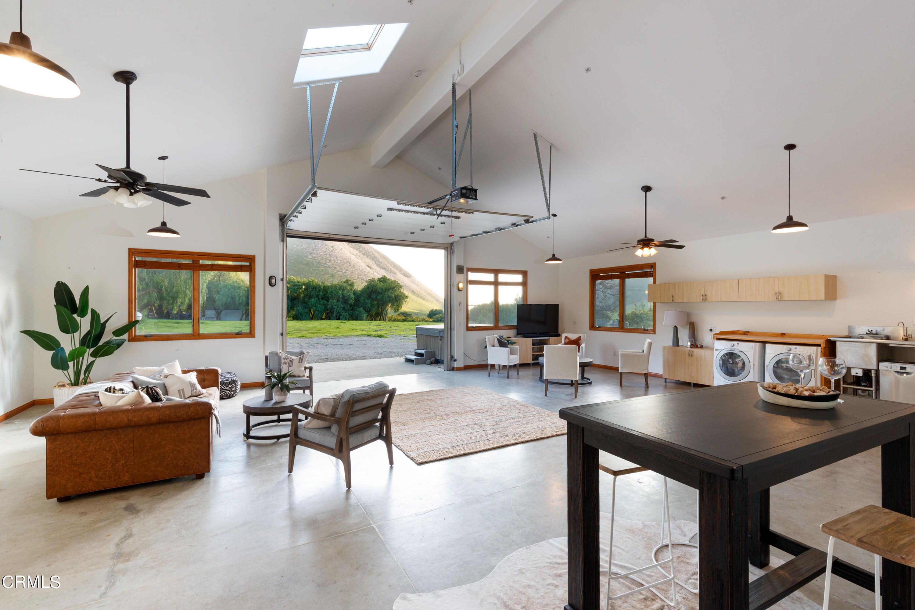 119 Hollister Ranch Road Goleta, CA 93117 - Photo 24 of 40 a living room with lots of furniture and a large window