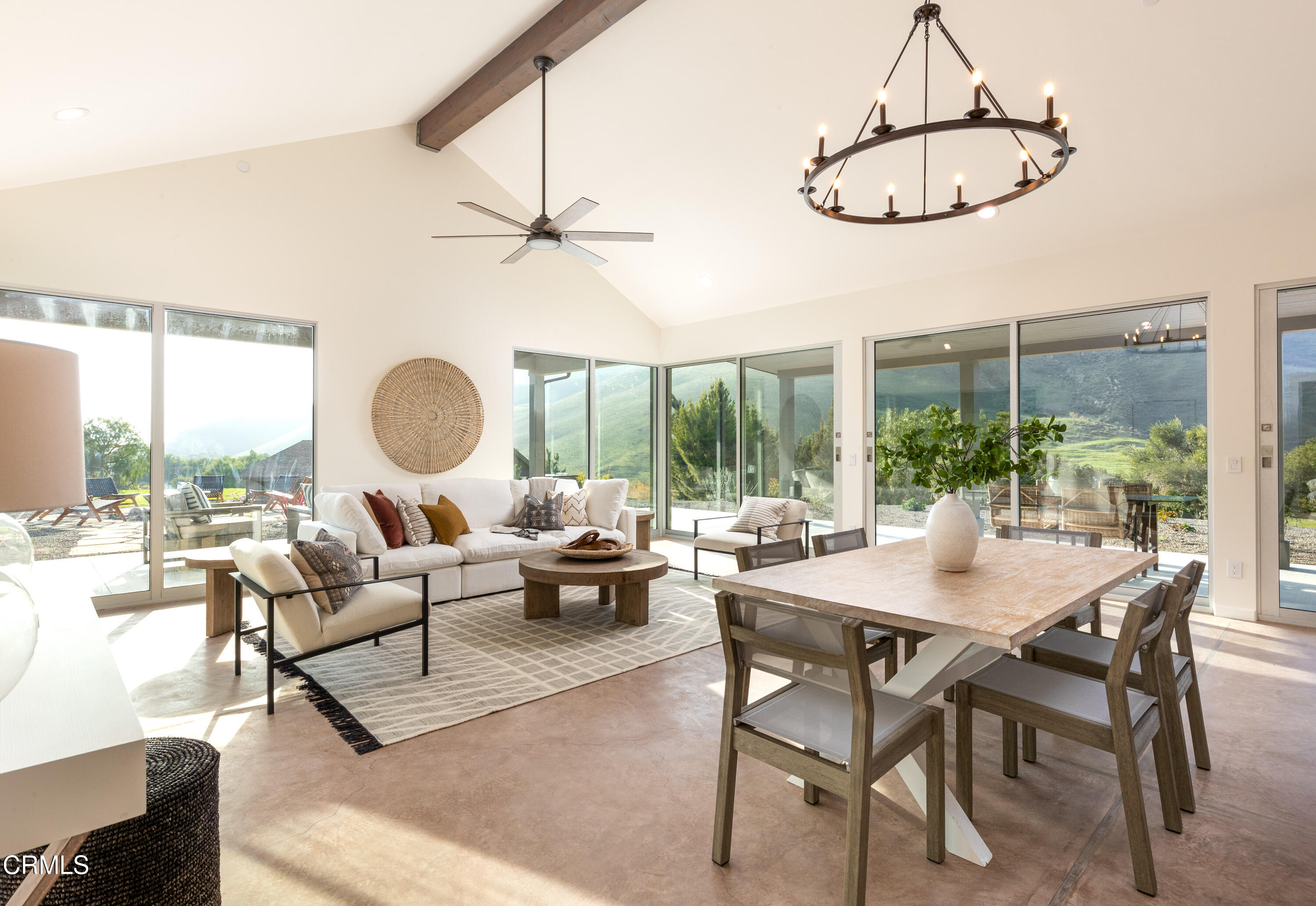 119 Hollister Ranch Road Goleta, CA 93117 - Photo 3 of 40 a living room with furniture a large window and a table