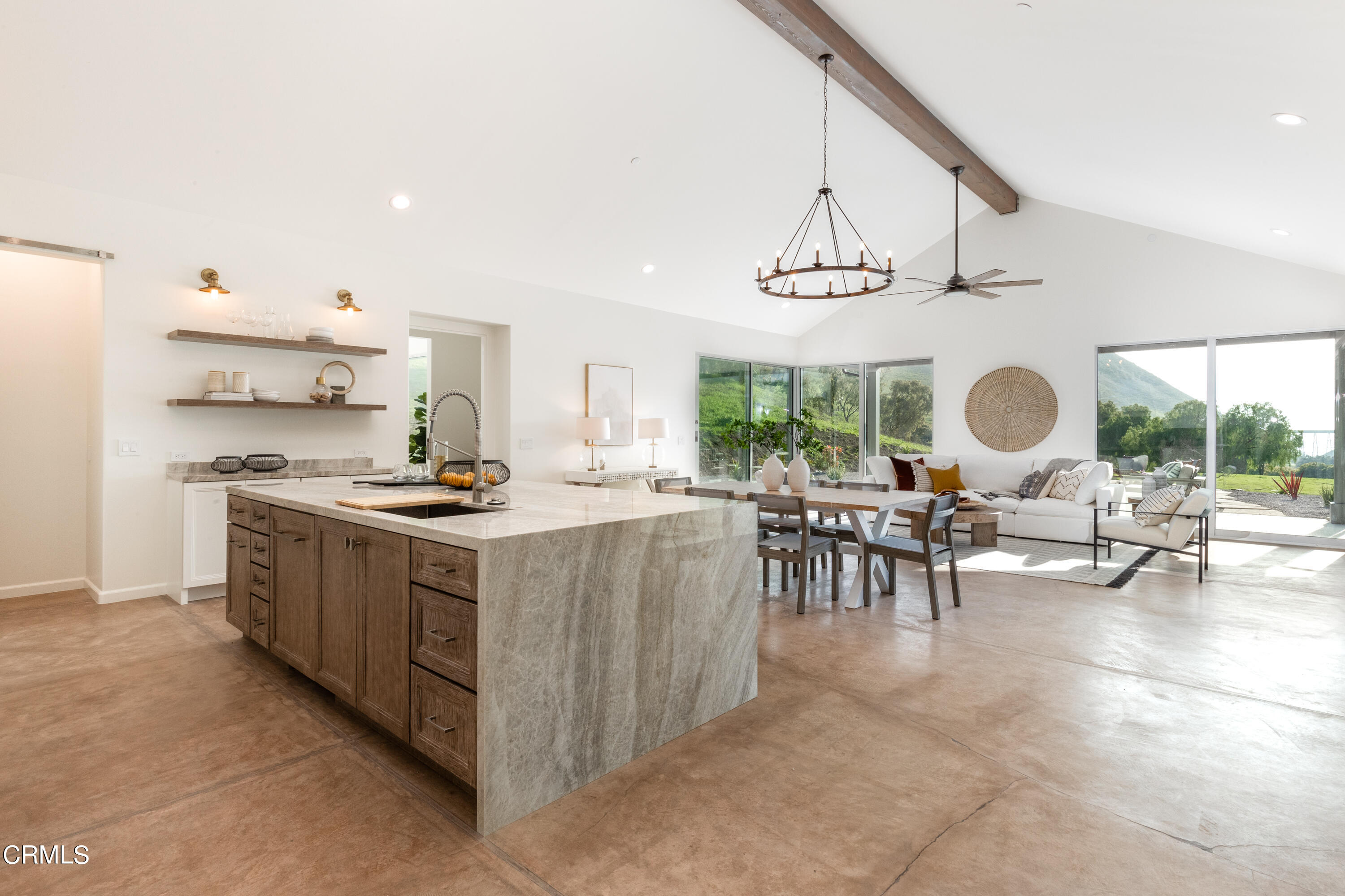 119 Hollister Ranch Road Goleta, CA 93117 - Photo 4 of 40 a kitchen with stainless steel appliances a stove a sink and a dining table