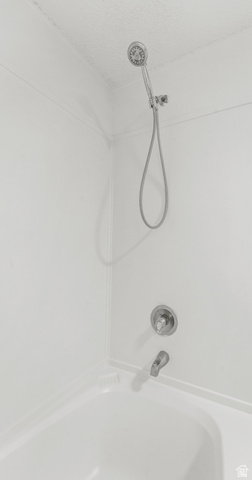 2875 North 400 West, Unit 7 Layton, UT 84041 - Photo 15 of 29 White tub and shower combination with a handheld showerhead and a single-handle temperature control