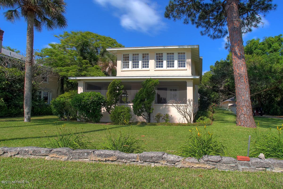 84 Water Street St. Augustine, FL 32084 - Photo 1 of 25 a front view of a house with a yard and trees