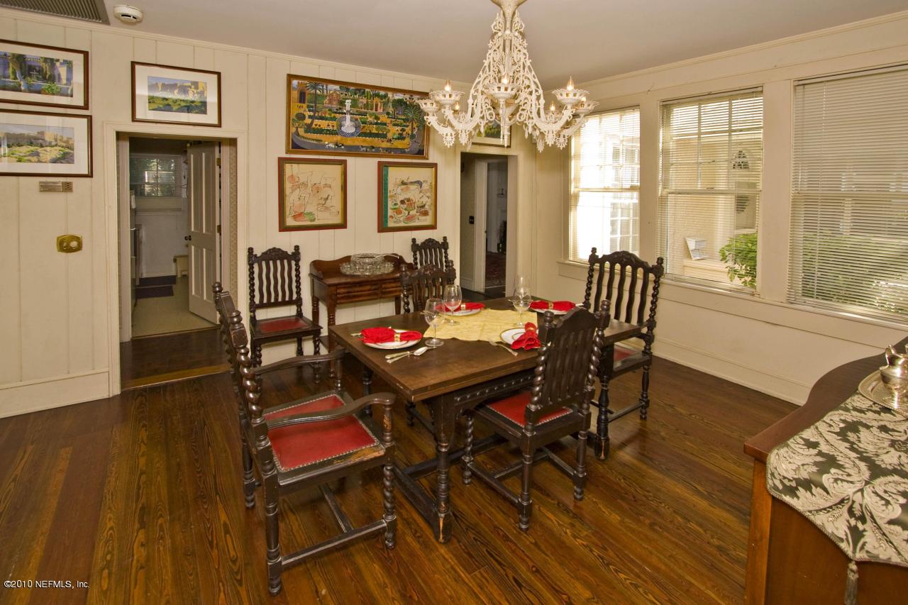 84 Water Street St. Augustine, FL 32084 - Photo 14 of 25 a view of a dining room with furniture and chandelier