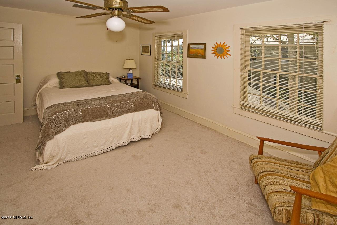 84 Water Street St. Augustine, FL 32084 - Photo 23 of 25 a bedroom with a bed and window