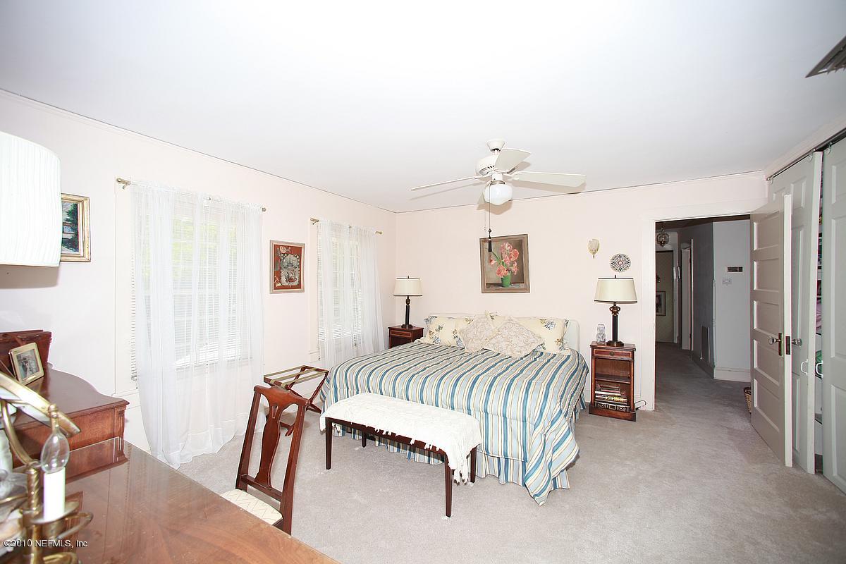 84 Water Street St. Augustine, FL 32084 - Photo 24 of 25 a bedroom with a bed and a table
