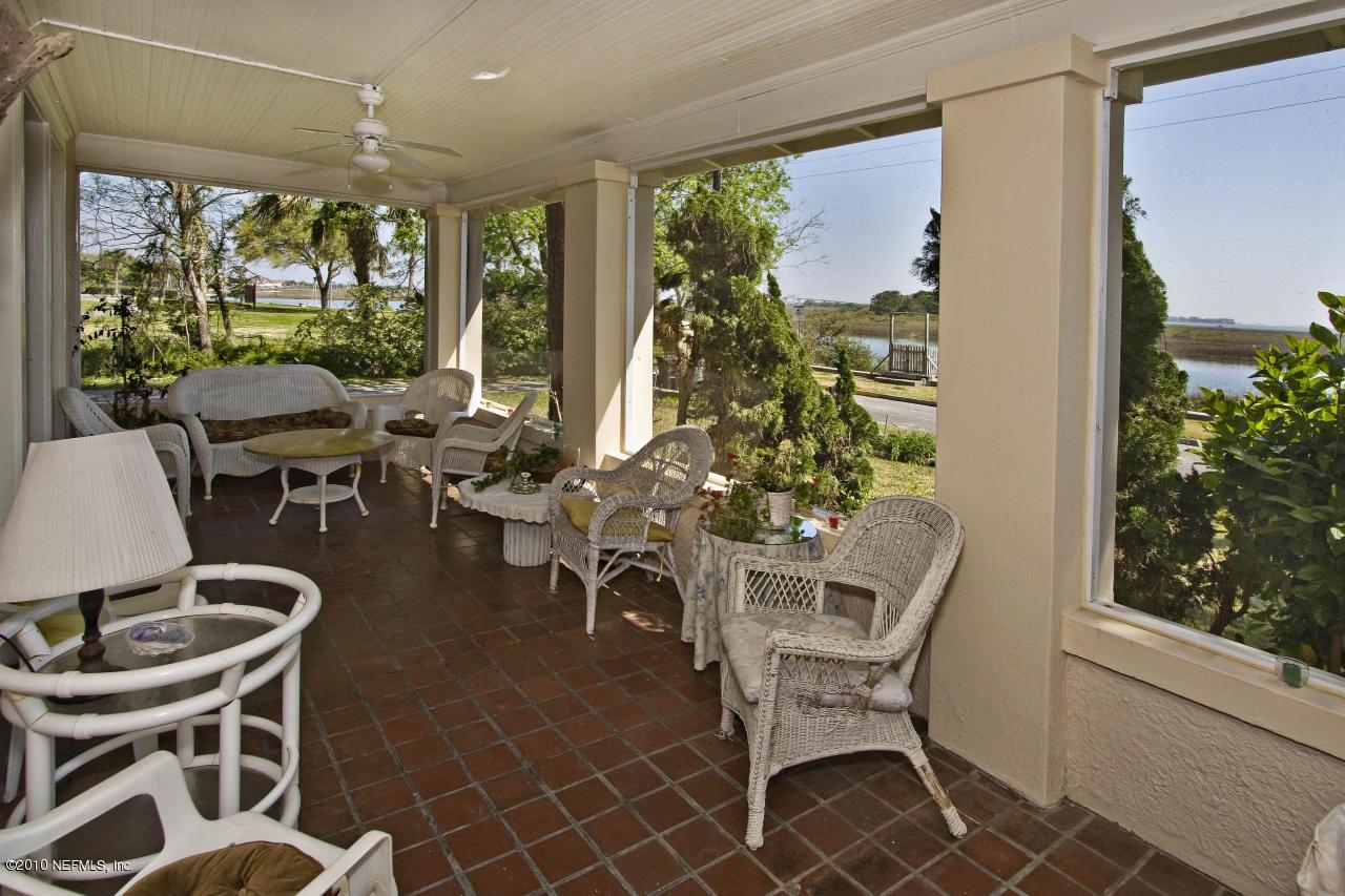 84 Water Street St. Augustine, FL 32084 - Photo 8 of 25 a dining room with furniture large windows and wooden floor