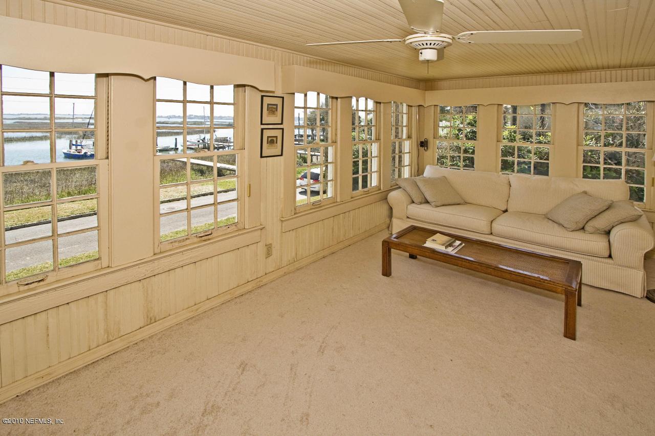 84 Water Street St. Augustine, FL 32084 - Photo 9 of 25 a living room with furniture and a large window