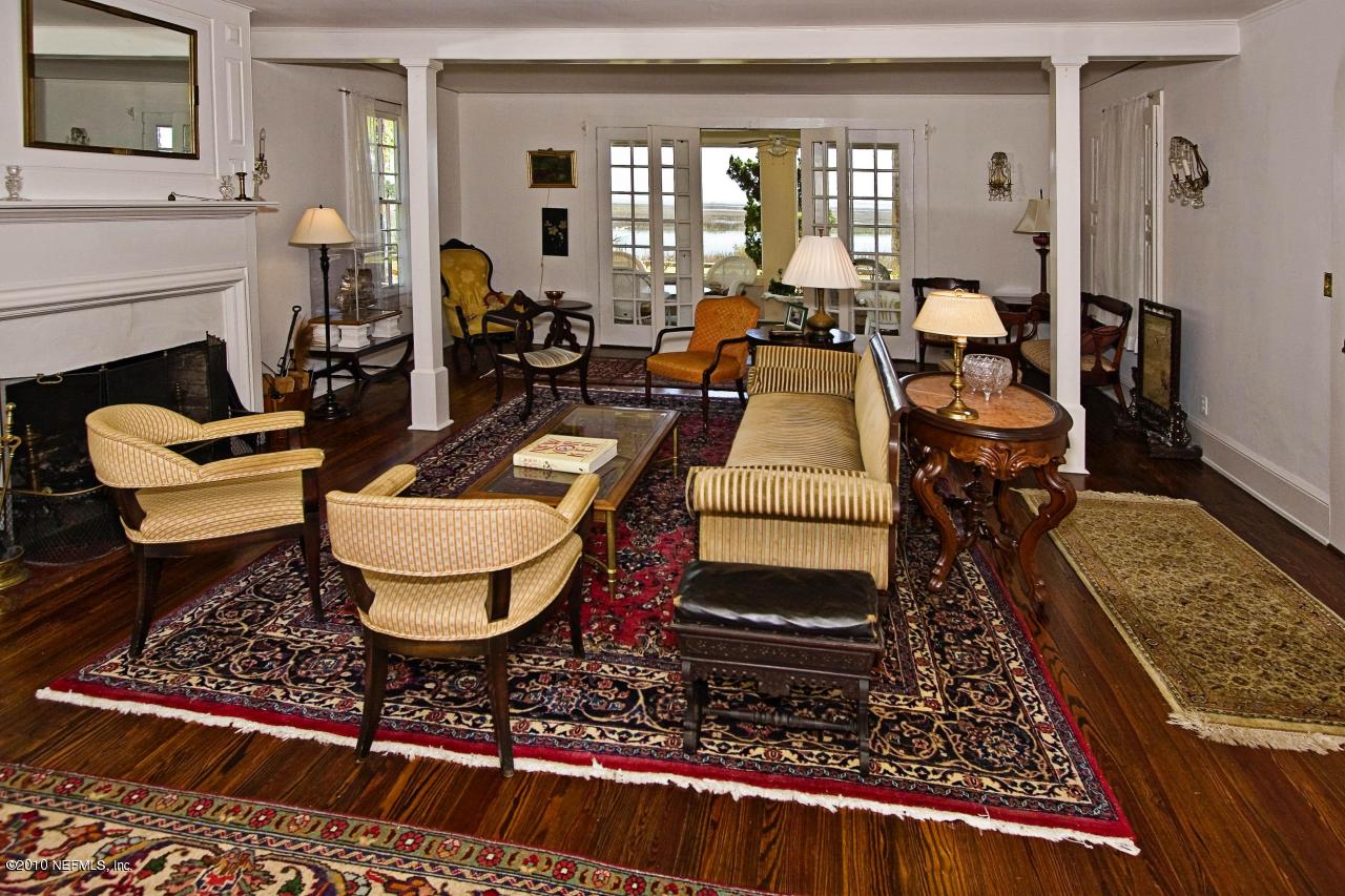 84 Water Street St. Augustine, FL 32084 - Photo 10 of 25 a very nice looking living room with a rug table and a fireplace