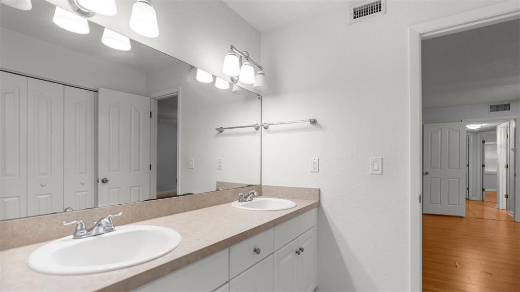 501 Southwest 75th Street, Unit B5 Gainesville, FL 32607 - Photo 17 of 38 a bathroom with a sink and a mirror