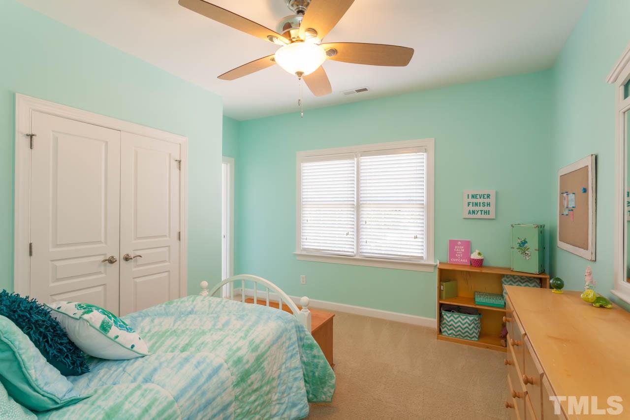 8814 Fidelis Lane Raleigh, NC 27613 - Photo 18 of 25 Spacious secondary bedrooms, each with private bath access.