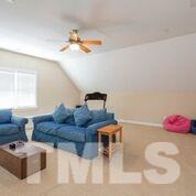 8814 Fidelis Lane Raleigh, NC 27613 - Photo 20 of 25 Finished 3rd Floor Media Room/Bonus Room with Full Bath and Walk In Storage. Excellent built in bench seating.