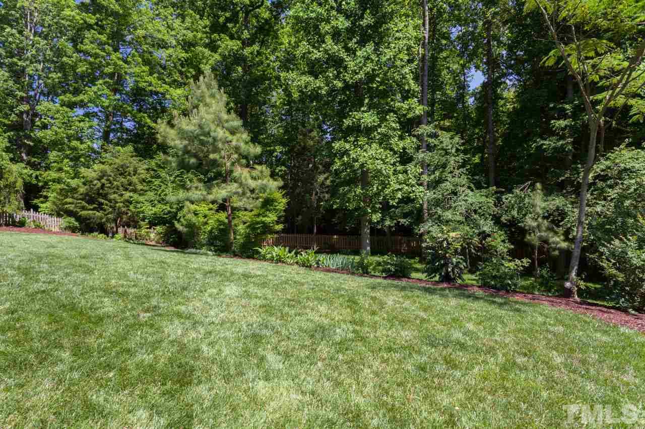 8814 Fidelis Lane Raleigh, NC 27613 - Photo 23 of 25 Gorgeous wooded fenced yard with lots of privacy!