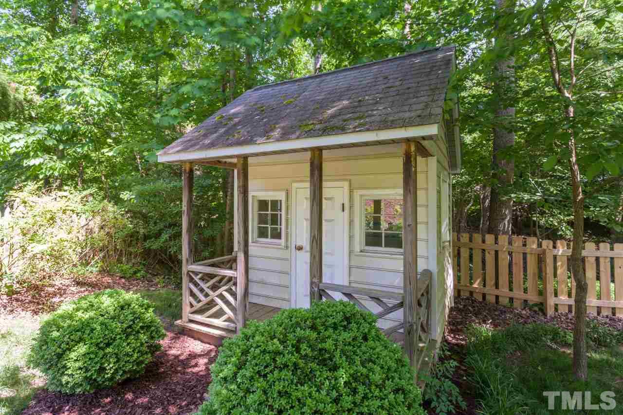 8814 Fidelis Lane Raleigh, NC 27613 - Photo 24 of 25 This charming playhouse has been enjoyed by many in the neighborhood! Conveys 'as is" for the new buyer to enjoy.