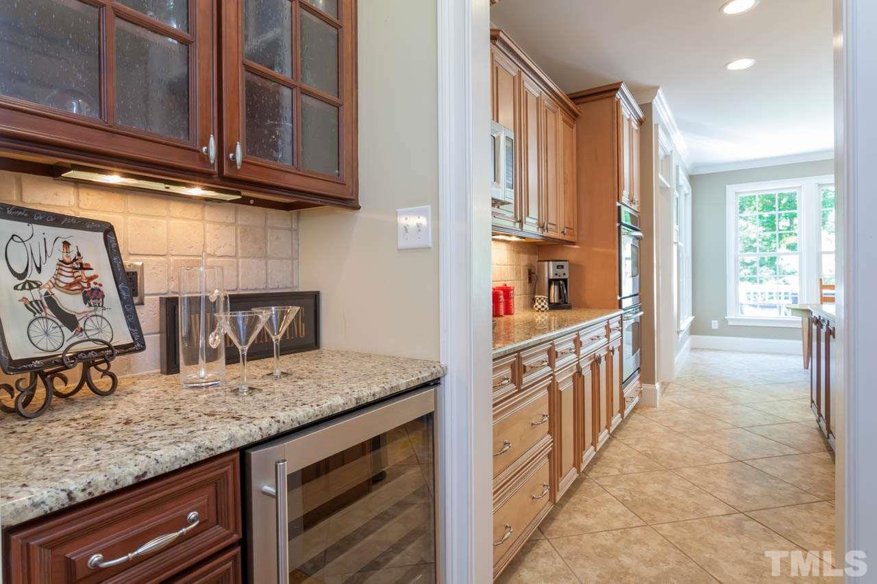 8814 Fidelis Lane Raleigh, NC 27613 - Photo 4 of 25 Entertaining made easy with this beautiful Butler's Pantry equipped with mini-fridge.