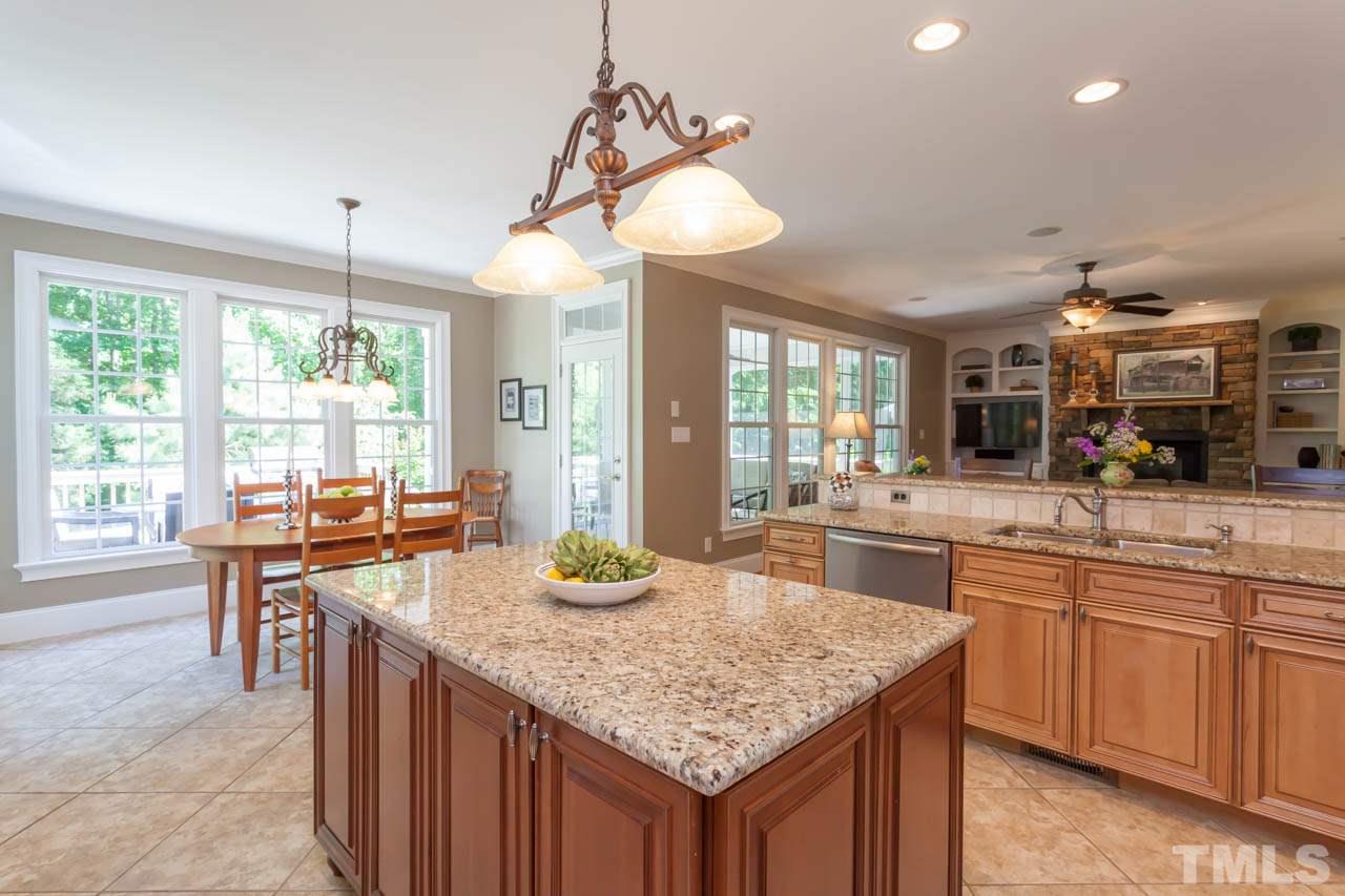8814 Fidelis Lane Raleigh, NC 27613 - Photo 8 of 25 Another great view of this fabulous kitchen with beautiful Breakfast area.