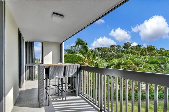 a view of a balcony from a corridor