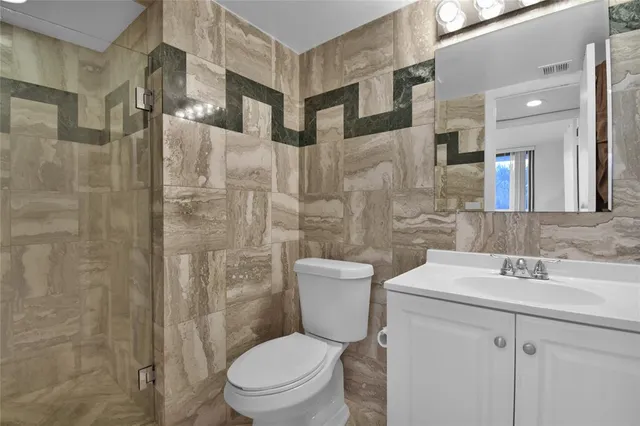 a spacious bedroom with a large bed and a large window