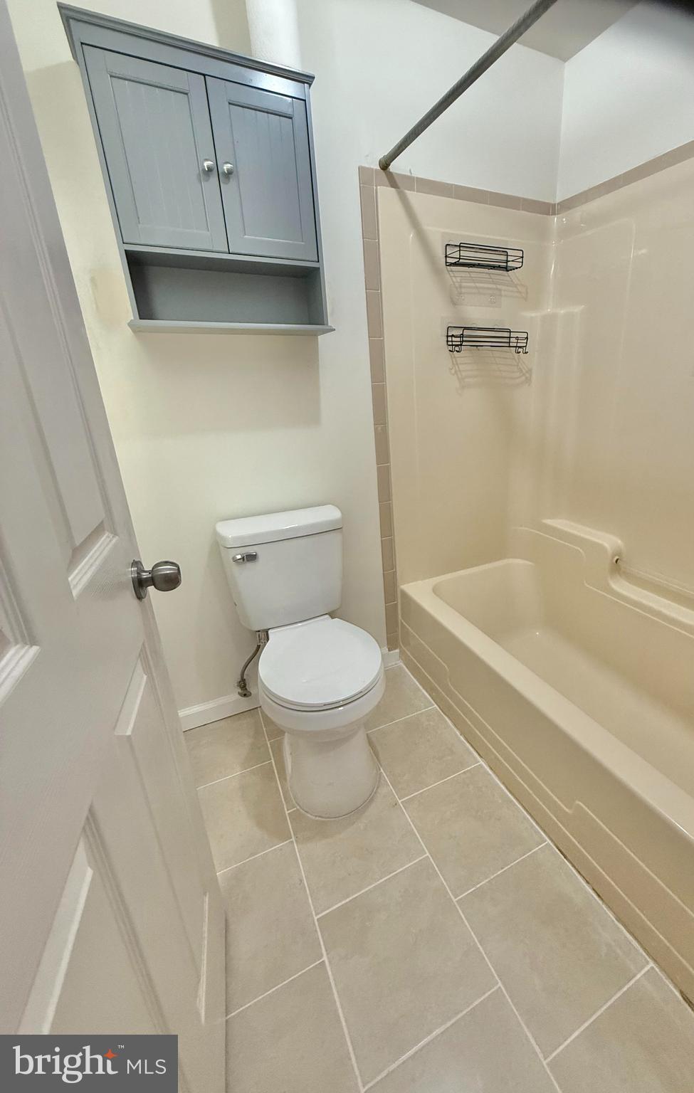 8349 Windfall Road Springfield, VA 22153 - Photo 35 of 48 a bathroom with a toilet and a shower