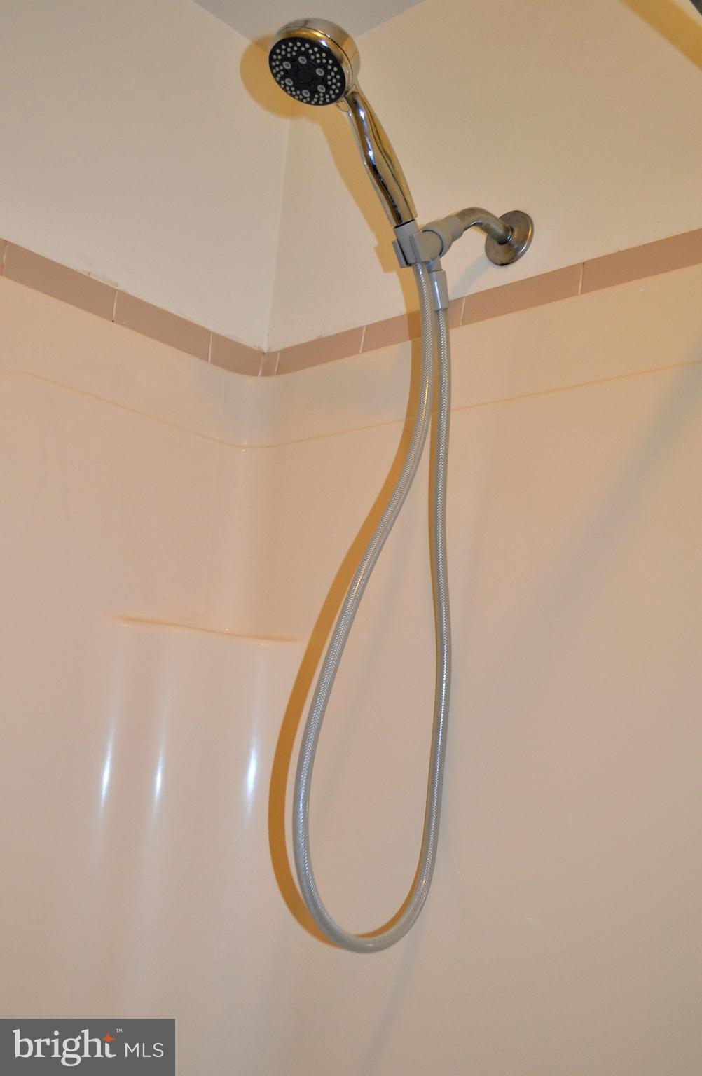 8349 Windfall Road Springfield, VA 22153 - Photo 36 of 48 a bathroom with a mirror and a shower