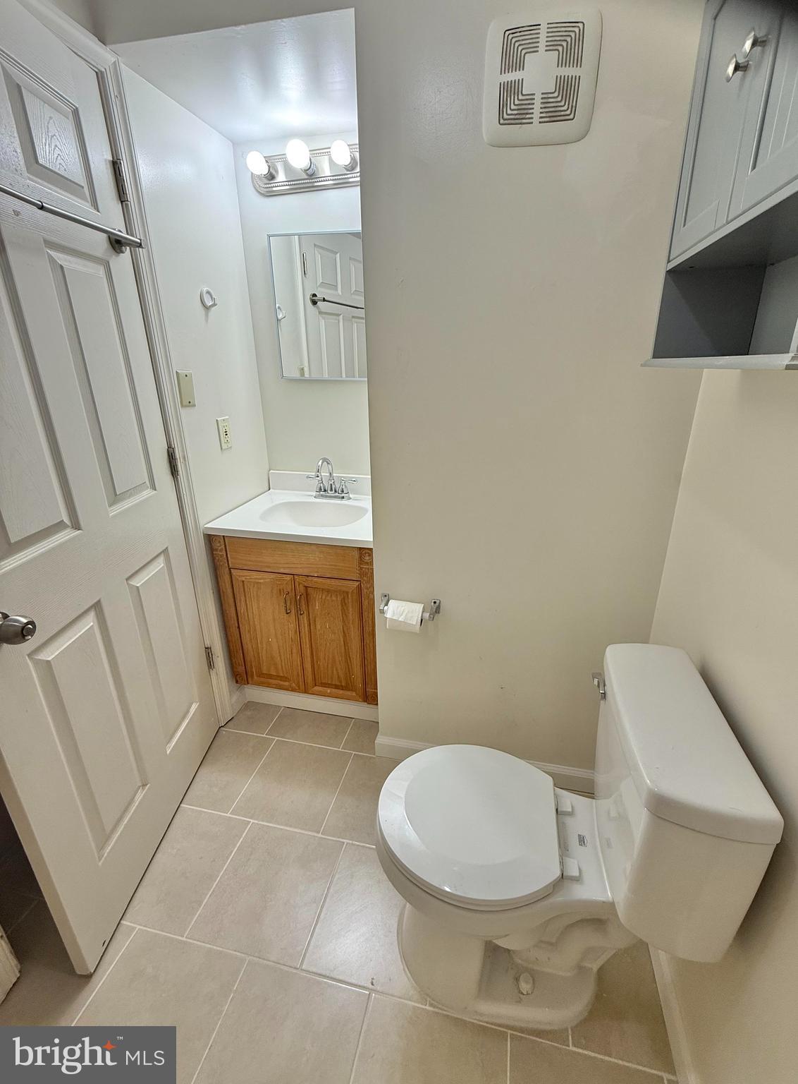 8349 Windfall Road Springfield, VA 22153 - Photo 37 of 48 a bathroom with a sink a toilet and a mirror