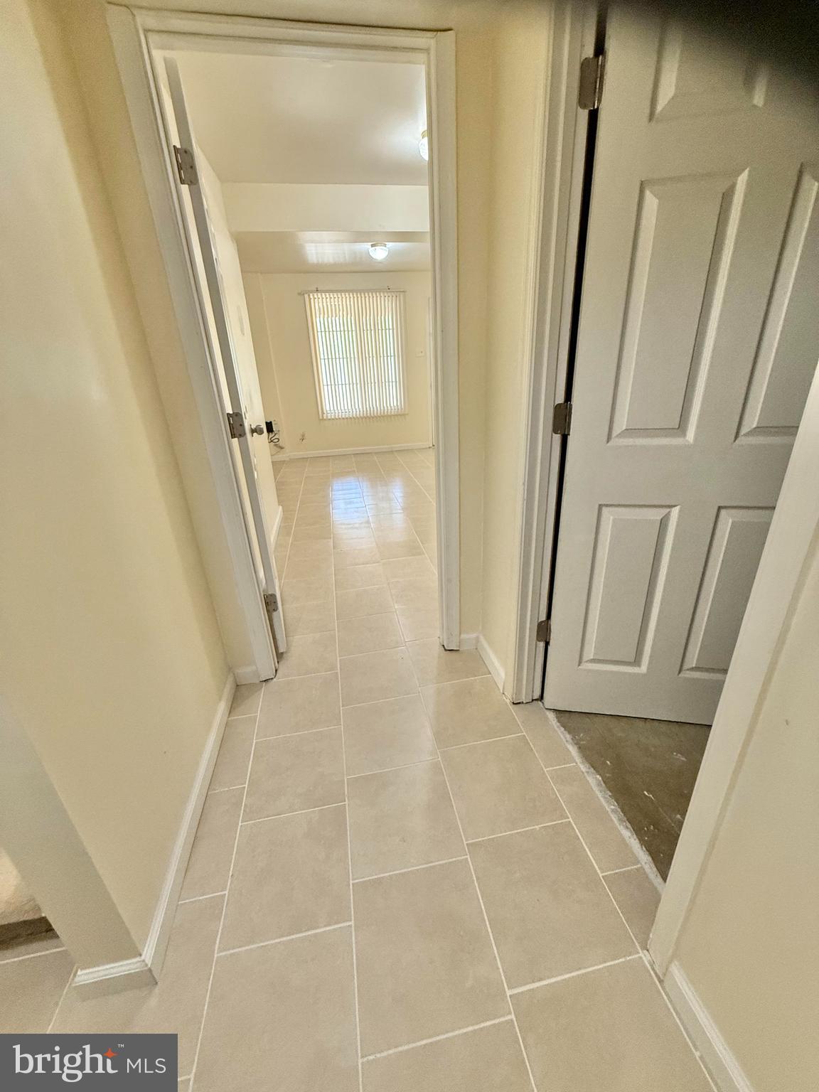 8349 Windfall Road Springfield, VA 22153 - Photo 38 of 48 a bathroom with a glass door shower a sink and a mirror
