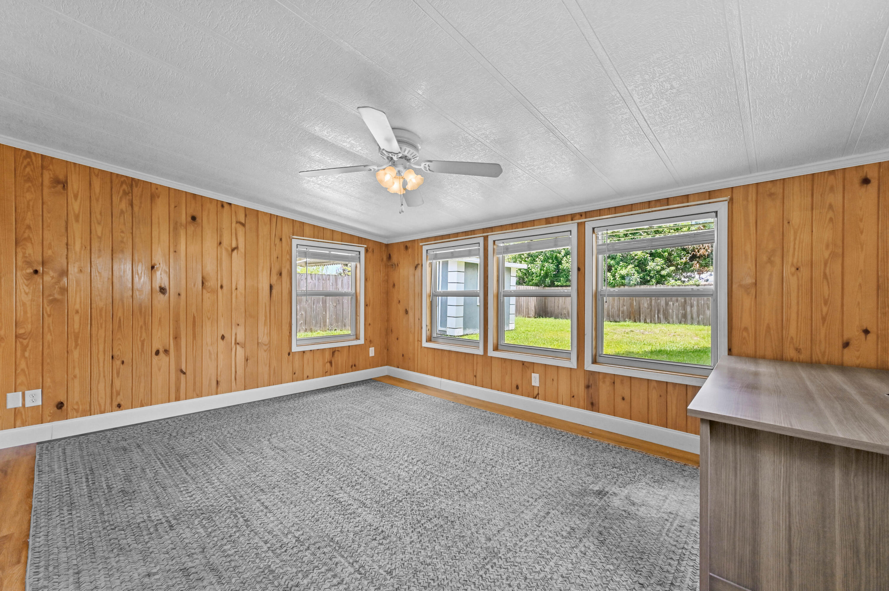 5709 Southeast Indigo Avenue Stuart, FL 34997 - Photo 14 of 26 a view of an empty room with a window