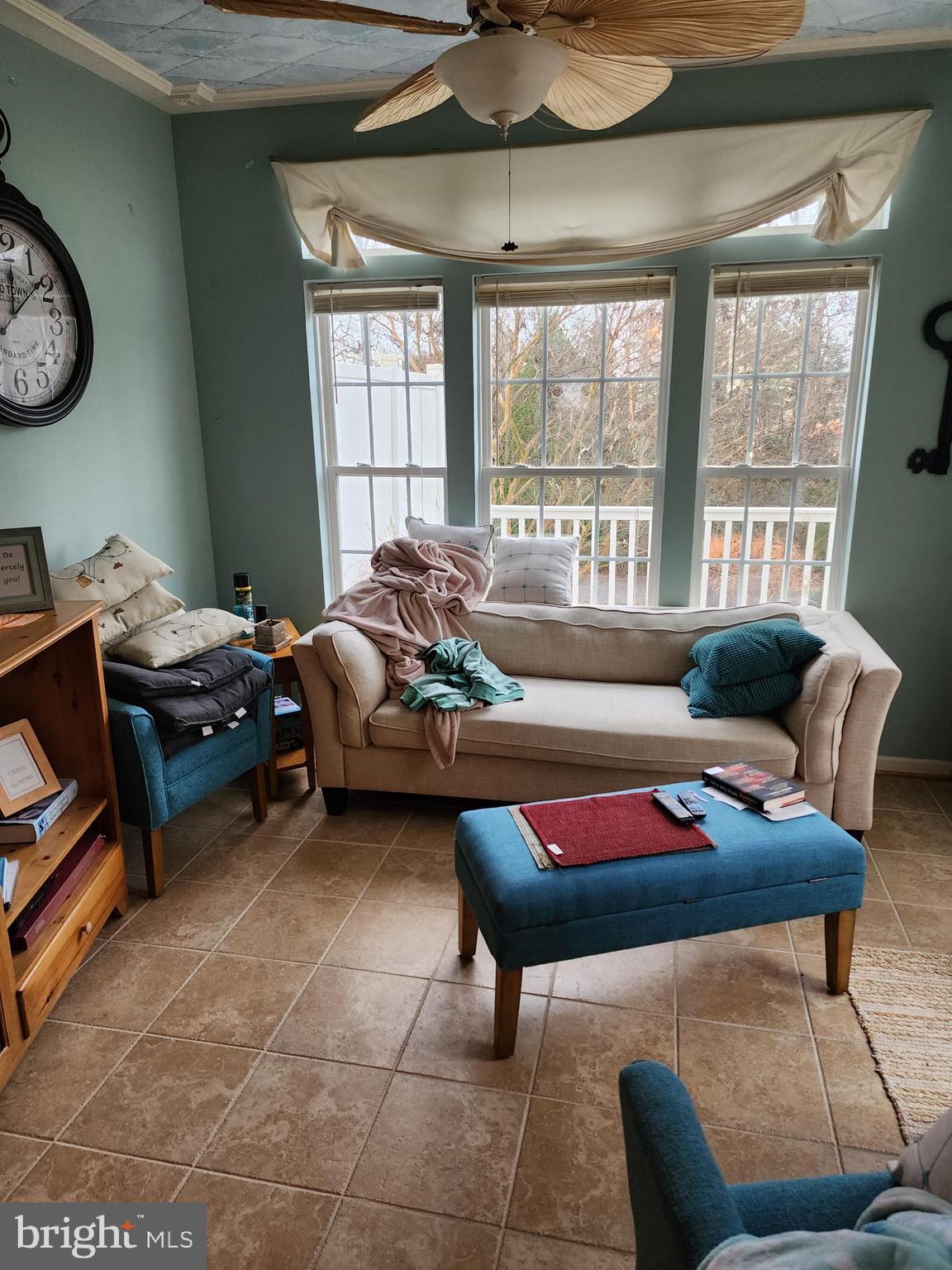 701 Monroe Point Drive Colonial Beach, VA 22443 - Photo 11 of 13 a living room with furniture a rug and a window