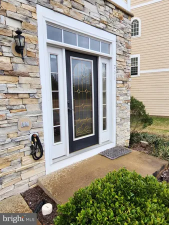 a view of a backyard of a house with outdoor seating