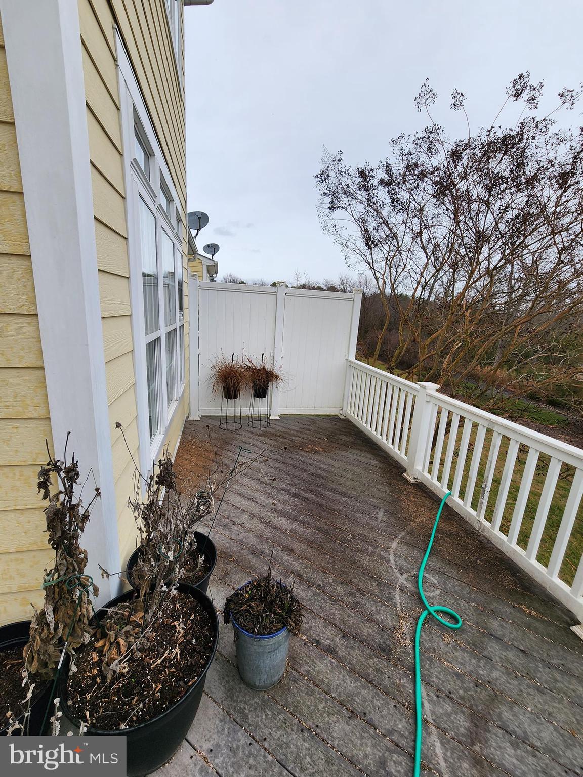 701 Monroe Point Drive Colonial Beach, VA 22443 - Photo 3 of 13 a view of a porch with furniture and floor to ceiling window