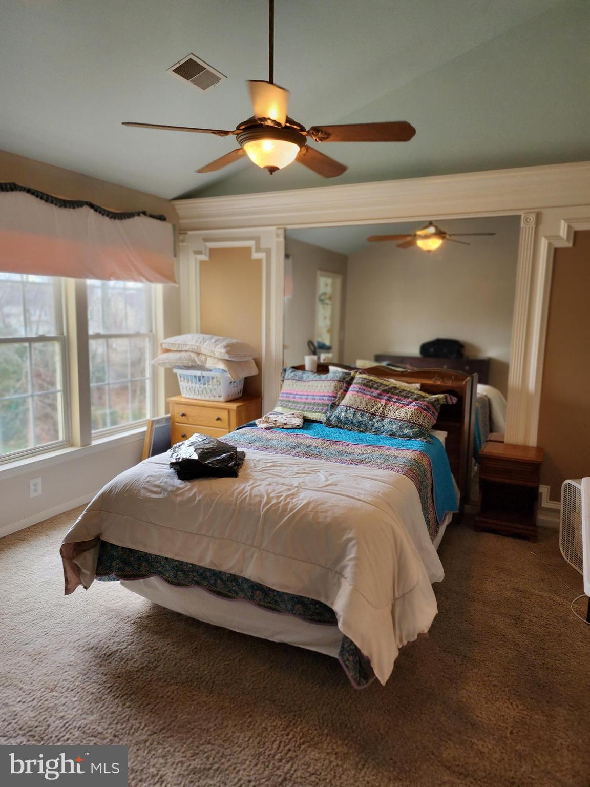 701 Monroe Point Drive Colonial Beach, VA 22443 - Photo 6 of 13 a bedroom with a bed window and dresser