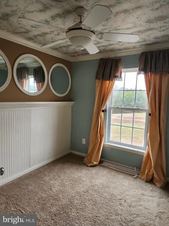 a view of a room that has a car and window
