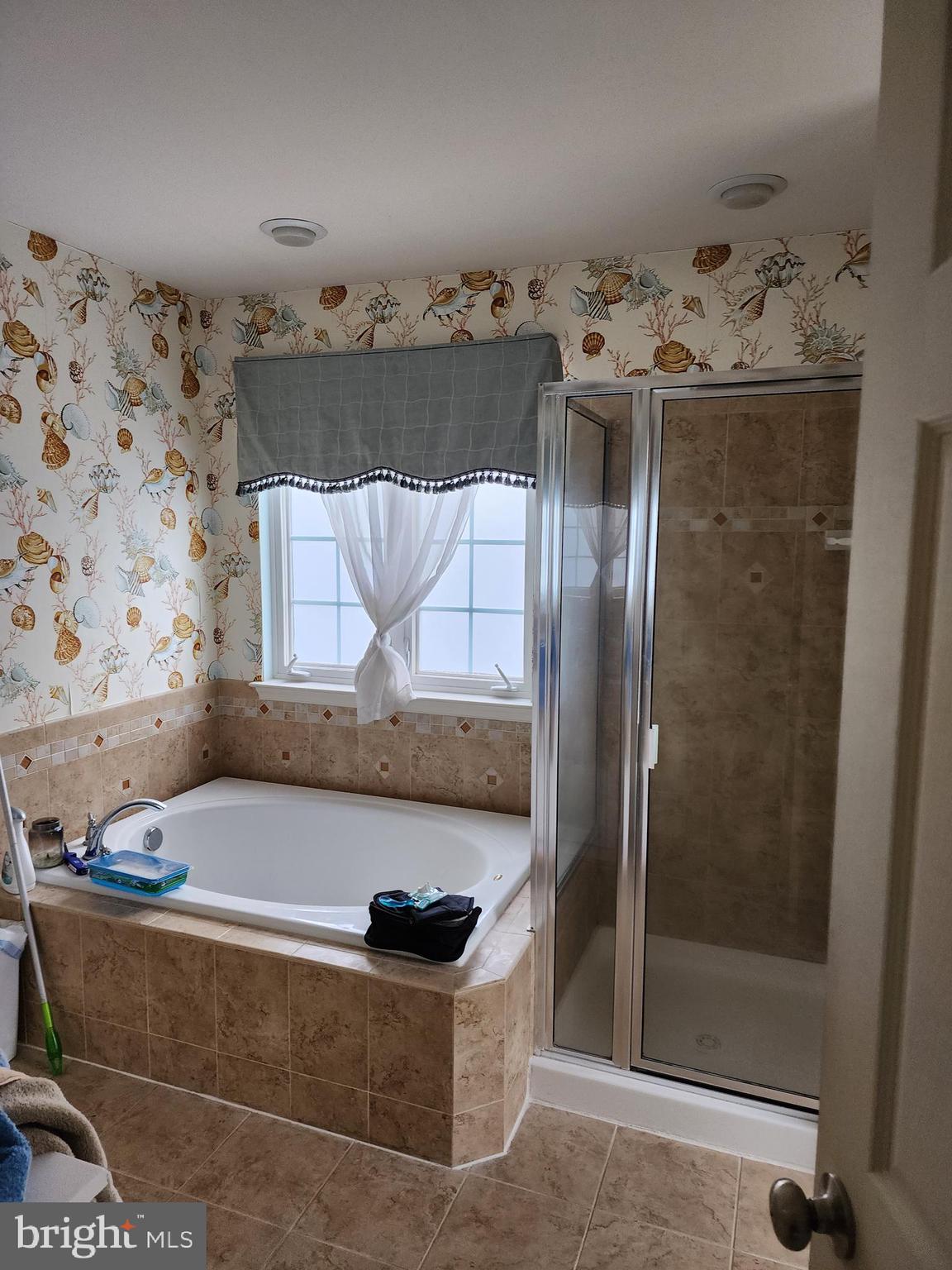 701 Monroe Point Drive Colonial Beach, VA 22443 - Photo 8 of 13 a bathroom with a tub and shower