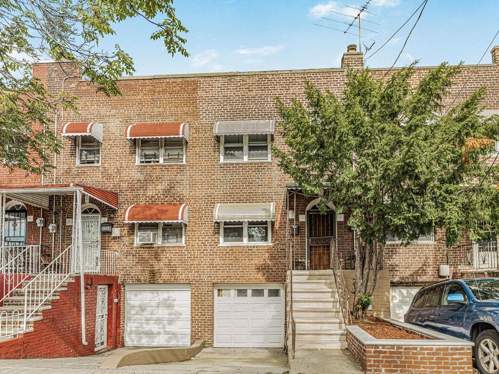 a front view of a house with parking