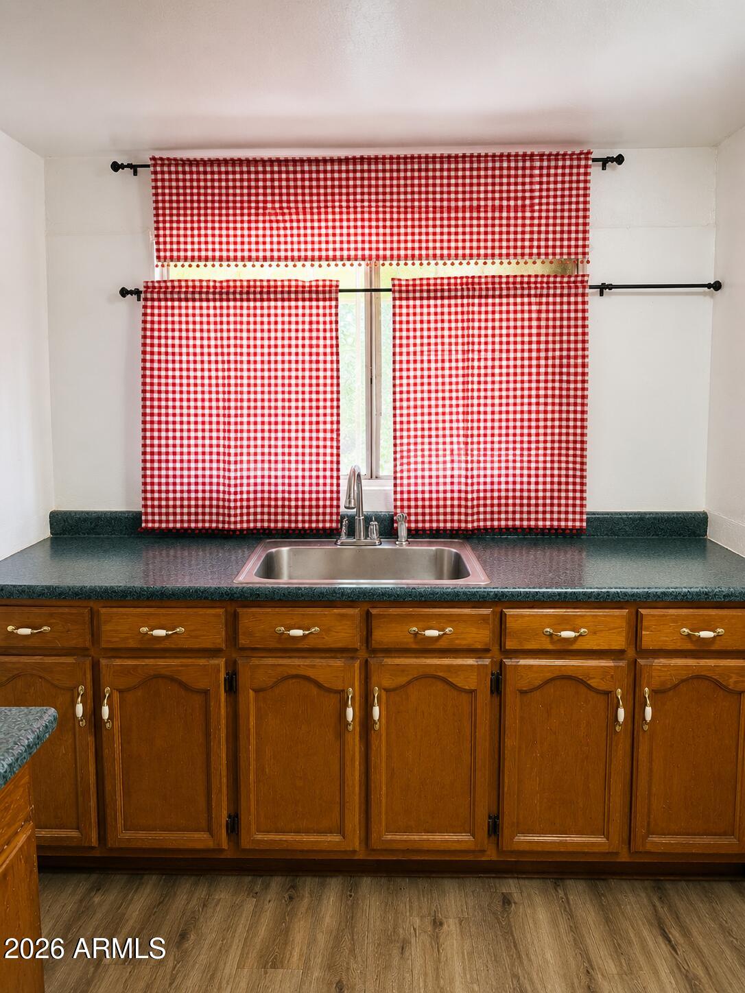 701 6th Green Street Douglas, AZ 85607 - Photo 4 of 10 a kitchen with a sink and cabinets