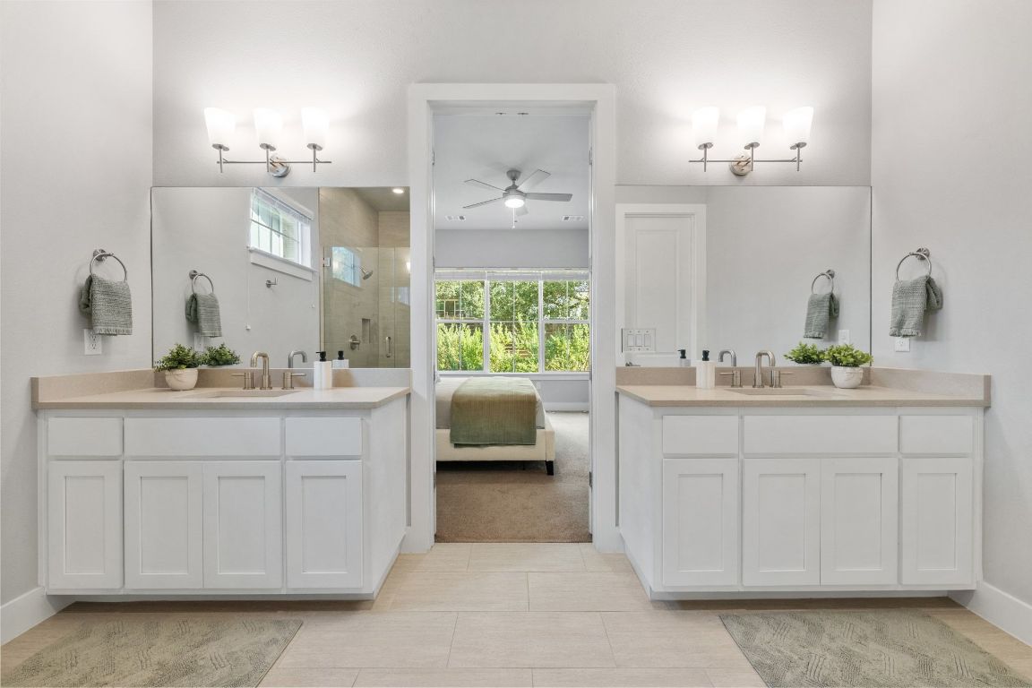 11112 Zimmerman Lane, Unit 24 Austin, TX 78726 - Photo 15 of 29 a bathroom with a sink vanity and a mirror