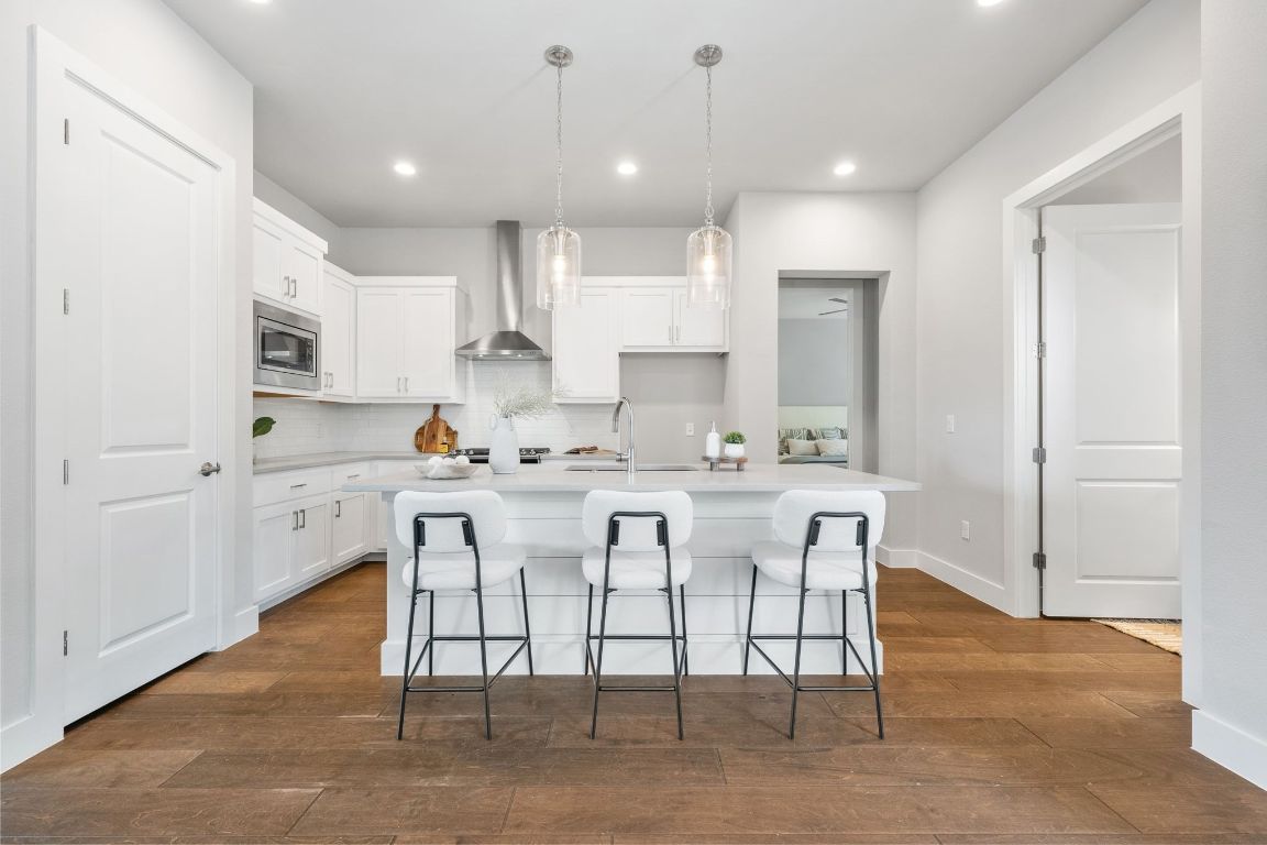 11112 Zimmerman Lane, Unit 24 Austin, TX 78726 - Photo 5 of 29 a kitchen with white cabinets and counter space