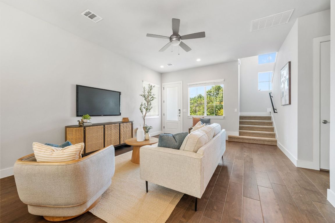 11112 Zimmerman Lane, Unit 24 Austin, TX 78726 - Photo 8 of 29 a living room with furniture and a flat screen tv