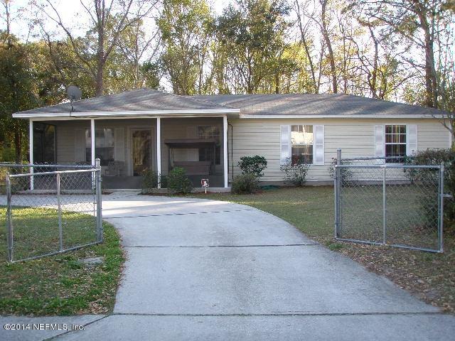 2070 Benedict Road Jacksonville, FL 32209 - Photo 1 of 38 front view of a house with a yard and potted plants