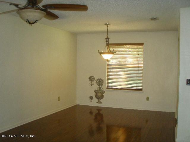 2070 Benedict Road Jacksonville, FL 32209 - Photo 17 of 38 a view of an empty room with a window