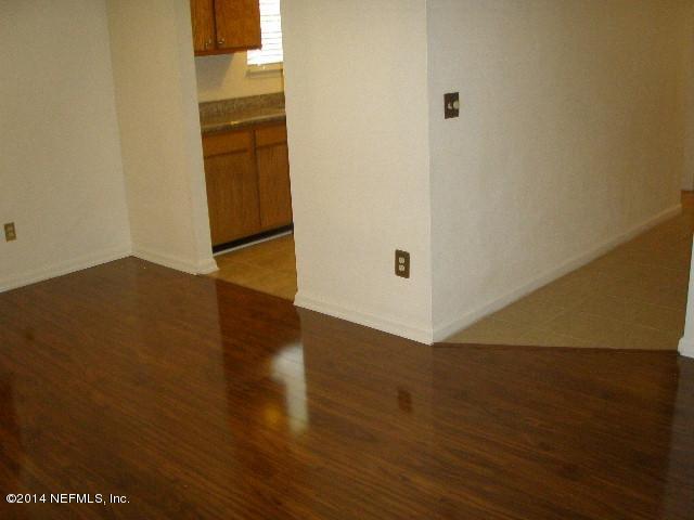 2070 Benedict Road Jacksonville, FL 32209 - Photo 20 of 38 an empty room with wooden floor