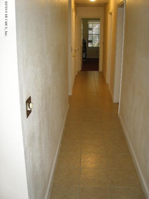 2070 Benedict Road Jacksonville, FL 32209 - Photo 26 of 38 a view of a hallway with wooden shelves