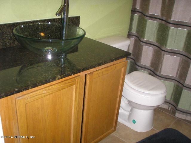 2070 Benedict Road Jacksonville, FL 32209 - Photo 38 of 38 a bathroom with a toilet and a sink