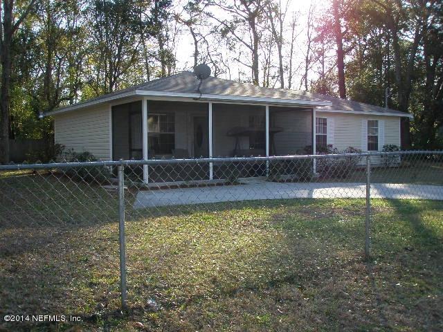 2070 Benedict Road Jacksonville, FL 32209 - Photo 4 of 38 a front view of a house with a yard